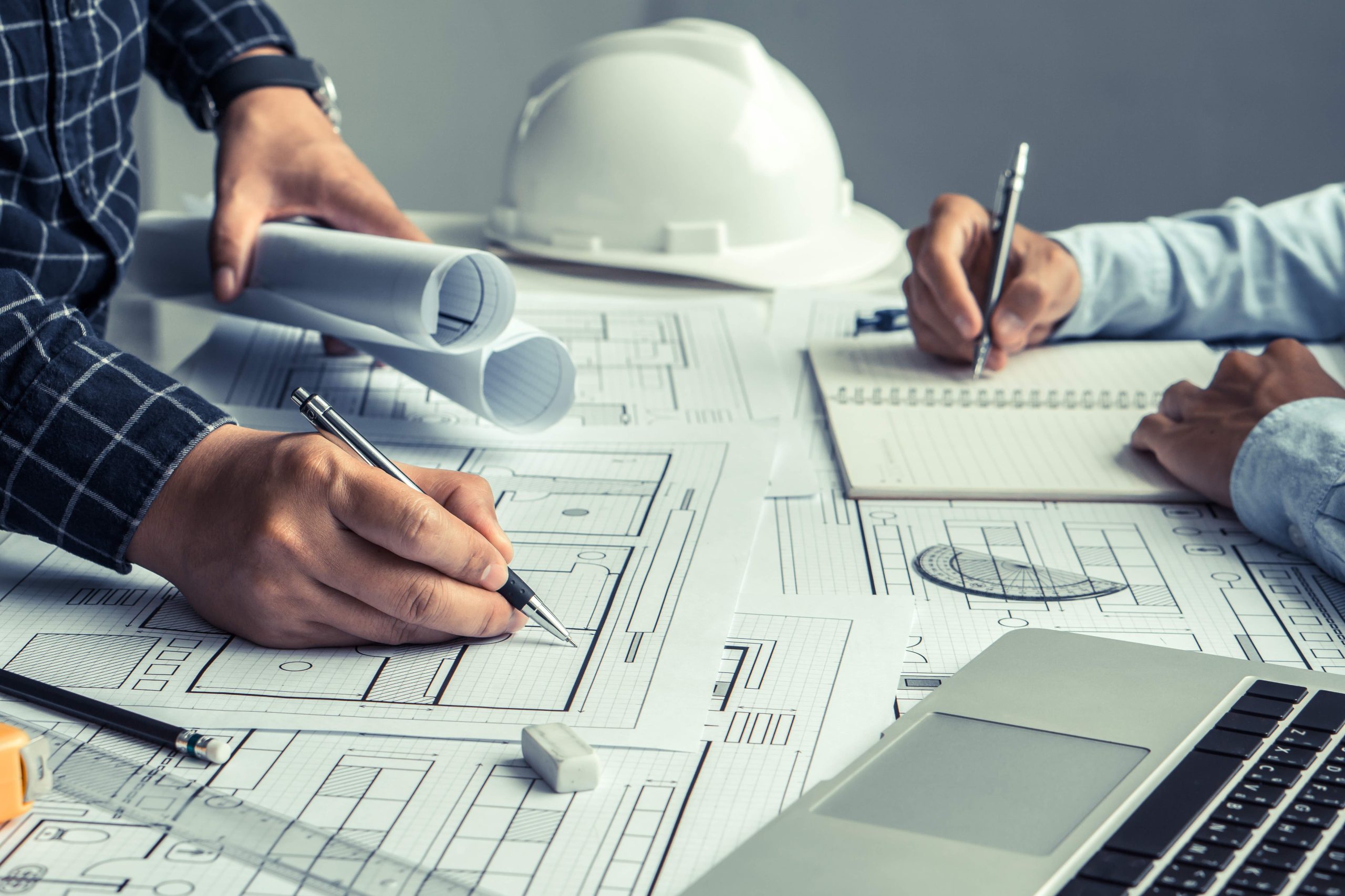 engineer team working in office with blue prints.Team of architects people.